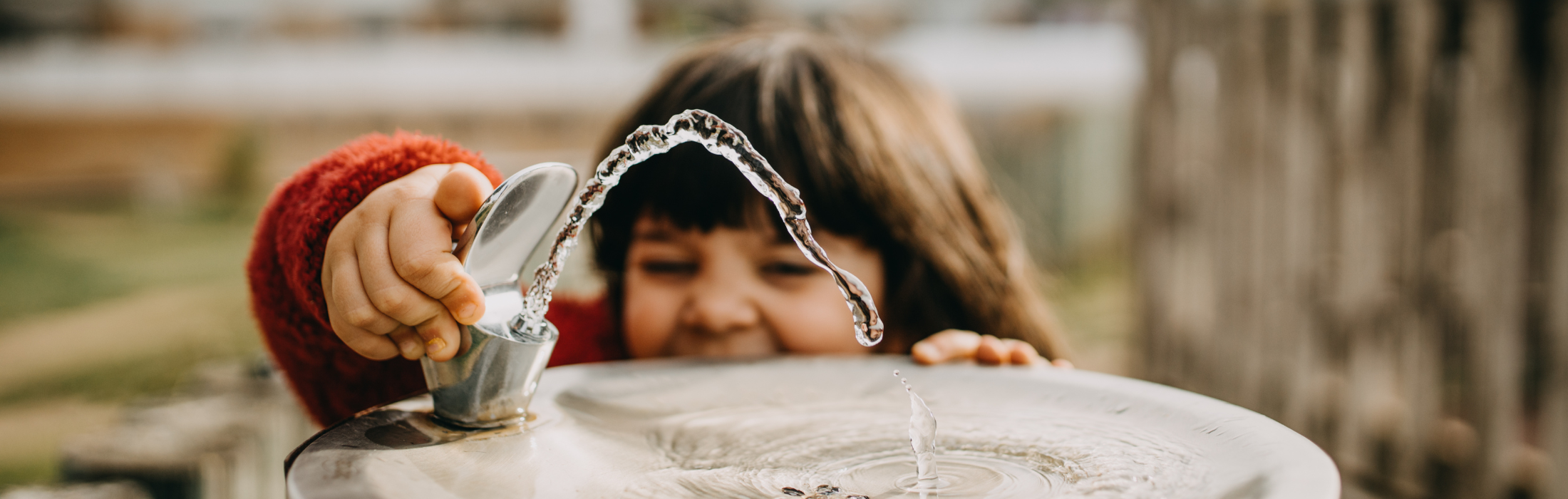 girl at drinking fountain